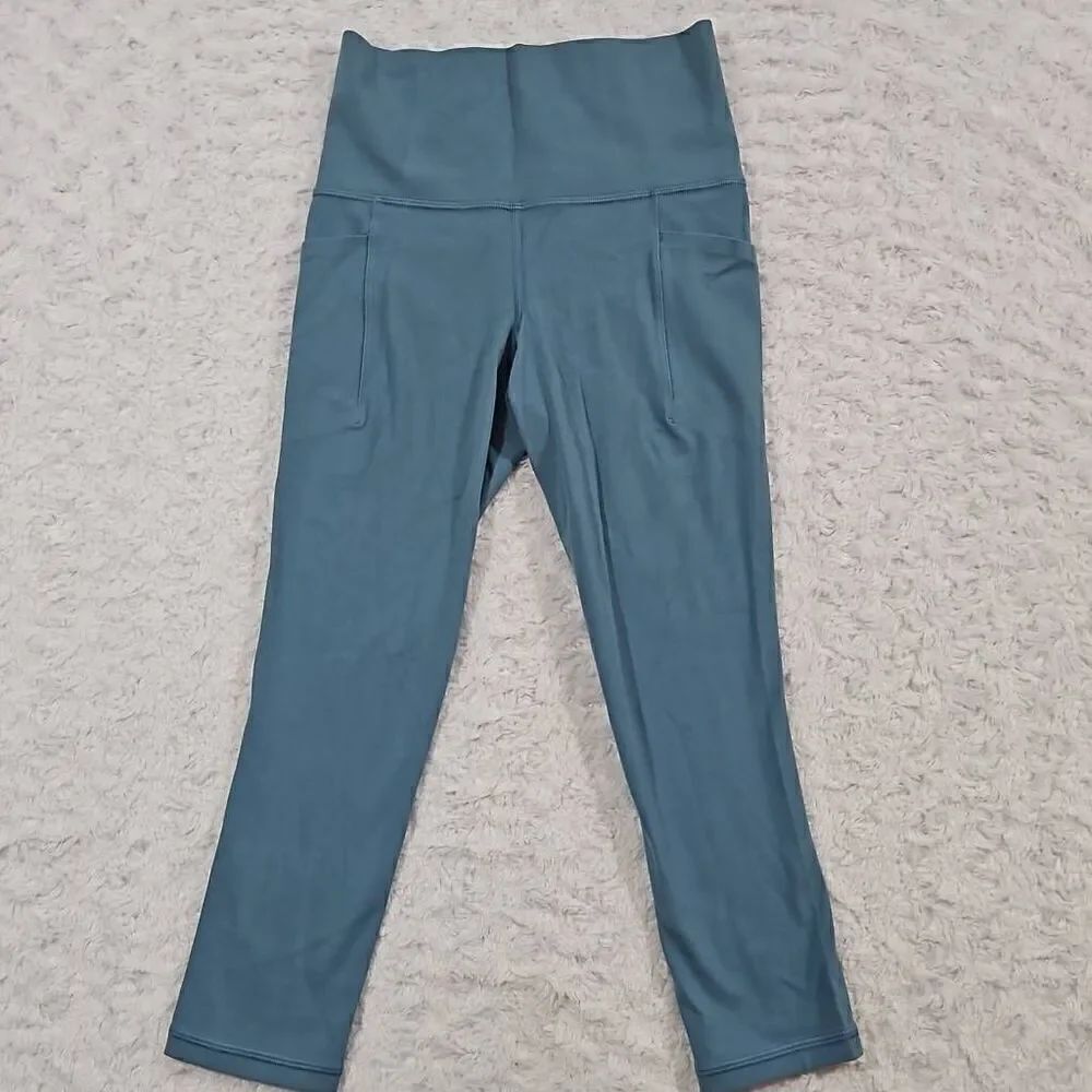 Athleta womens XXS light blue salutation stash pocket II Capri teal gym workout